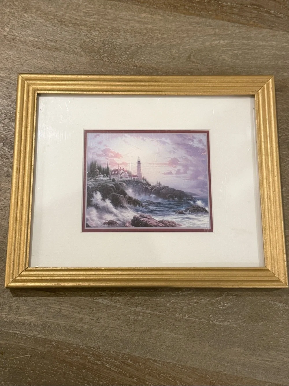 Thomas Kinkade Gold Framed Lighthouse Print with Blue Sky and White Clouds